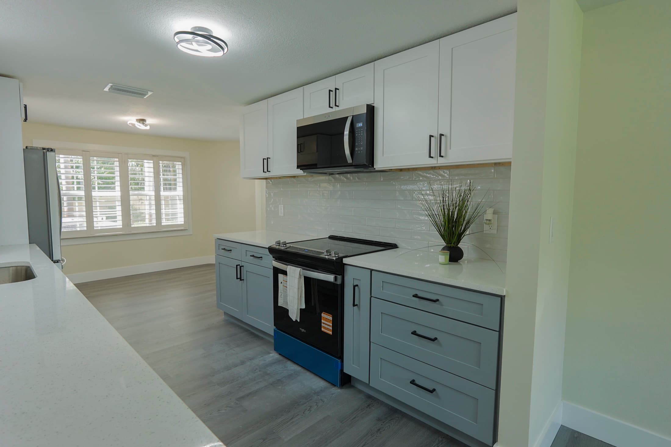Modern kitchen with stainless appliances and quartz countertops